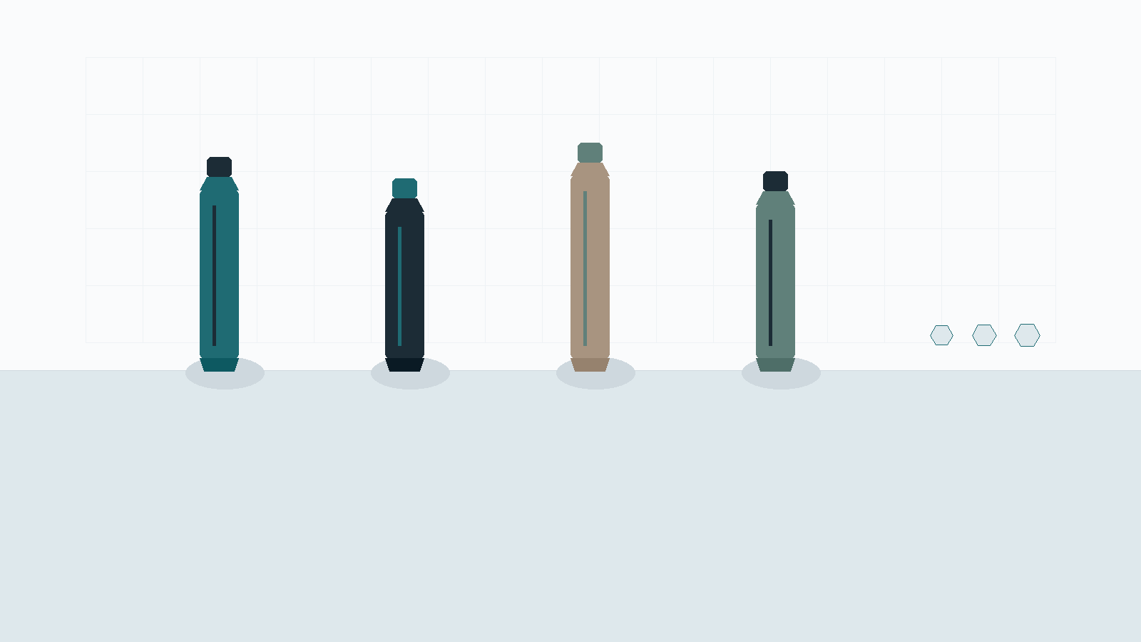 Four standing toothpaste tubes on a pale counter, with three small mineral chips as footnotes.